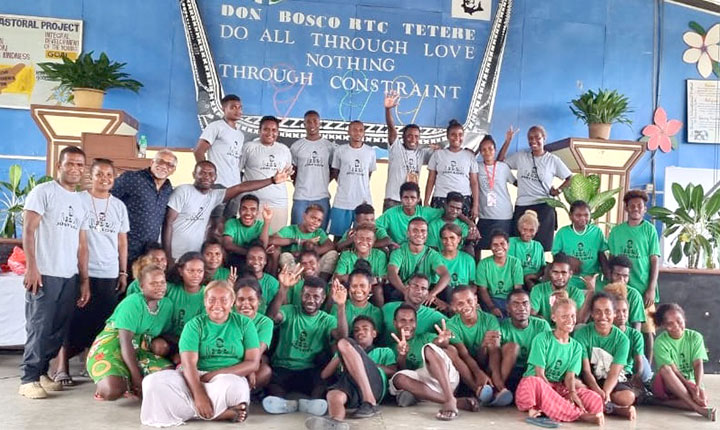 Young-People-posing-in-green-with-their-leaders-and-Fr.-Parappilly-during-Wantok-Bosco.jpg
